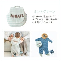 1歳の誕生日を家族で祝う赤ちゃんと両親。名入れベビーリュックを背負って歩く姿が思い出に